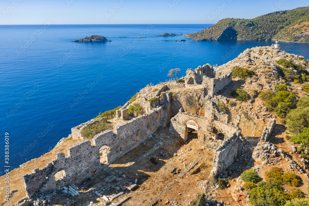 morning light on the ruins of antique city on the top of island at the Mediterranean sea with copy space