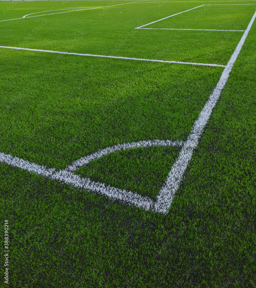 Artificial grass soccer field. Corner kick line of ball and a soccer field , football field , background texture Artificial grass soccer field. Corner kick line of ball and a soccer field , football field , background texture