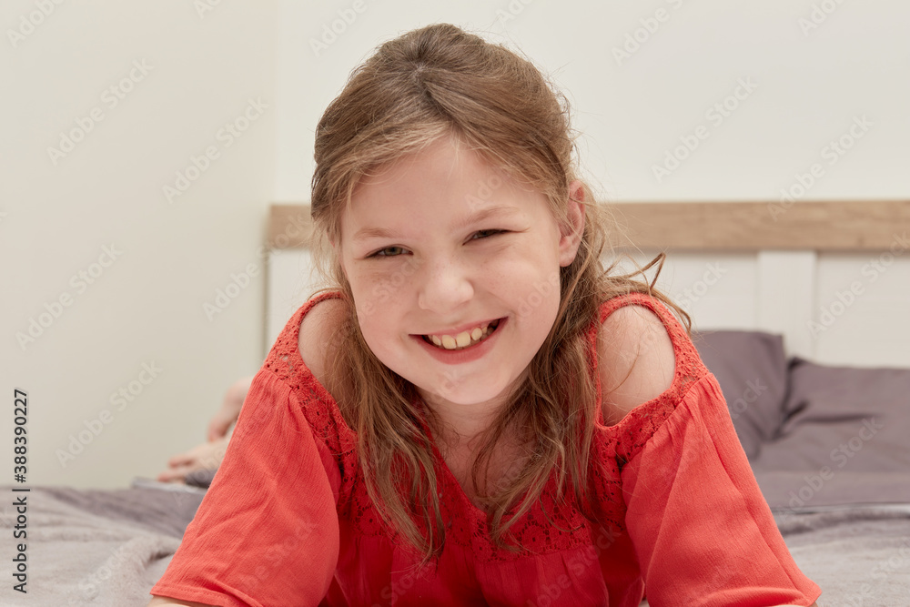 Happy happy blonde girl smiles, woke up, happy and looks at the camera. Morning in bed. Happy happy blonde girl smiles, woke up, happy and looks at the camera. Morning in bed.