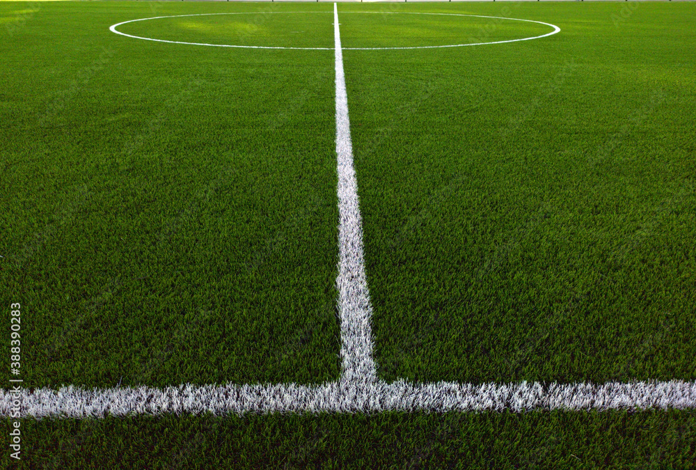 Obraz premium Artificial grass soccer field. Corner kick line of ball and a soccer field , football field , background texture