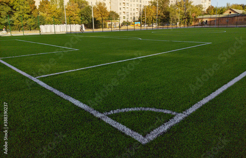 Artificial grass soccer field. Corner kick line of ball and a soccer field , football field , background texture