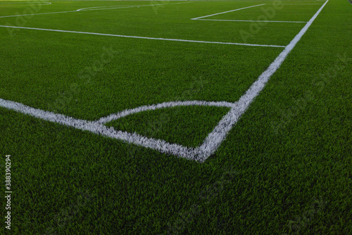 Artificial grass soccer field. Corner kick line of ball and a soccer field , football field , background texture © Smole