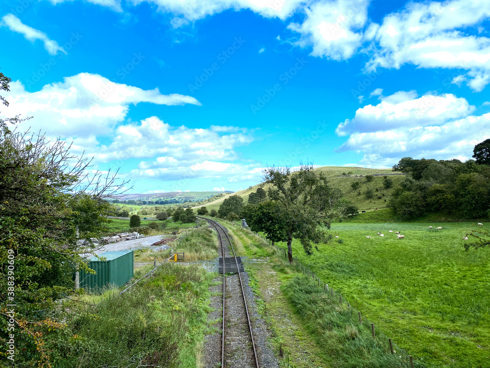 Railway line, runnning toward Skipton via Bolton Abbey, on a sunny day in, Draughton, Ilkley, UK