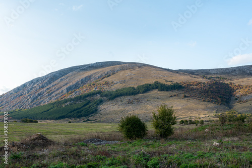 Bulgarian countryside rock hill autumn shades sunny day green warm forest