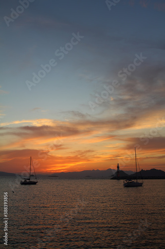 Seascape at sunset. Lighthouse on the coast. Seaside town of Turgutreis and spectacular sunsets © bt1976