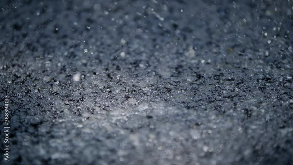 Water Poured On A Fresh Tarmac Asphalt Road Water Poured On A Fresh Tarmac Asphalt Road