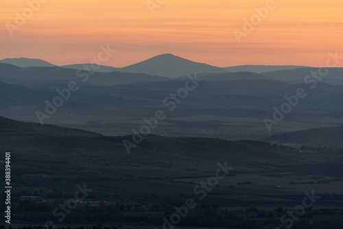 Landscape sunset colors over mountains and hills orange red yellow blue shades natural beauty bulgaria rural