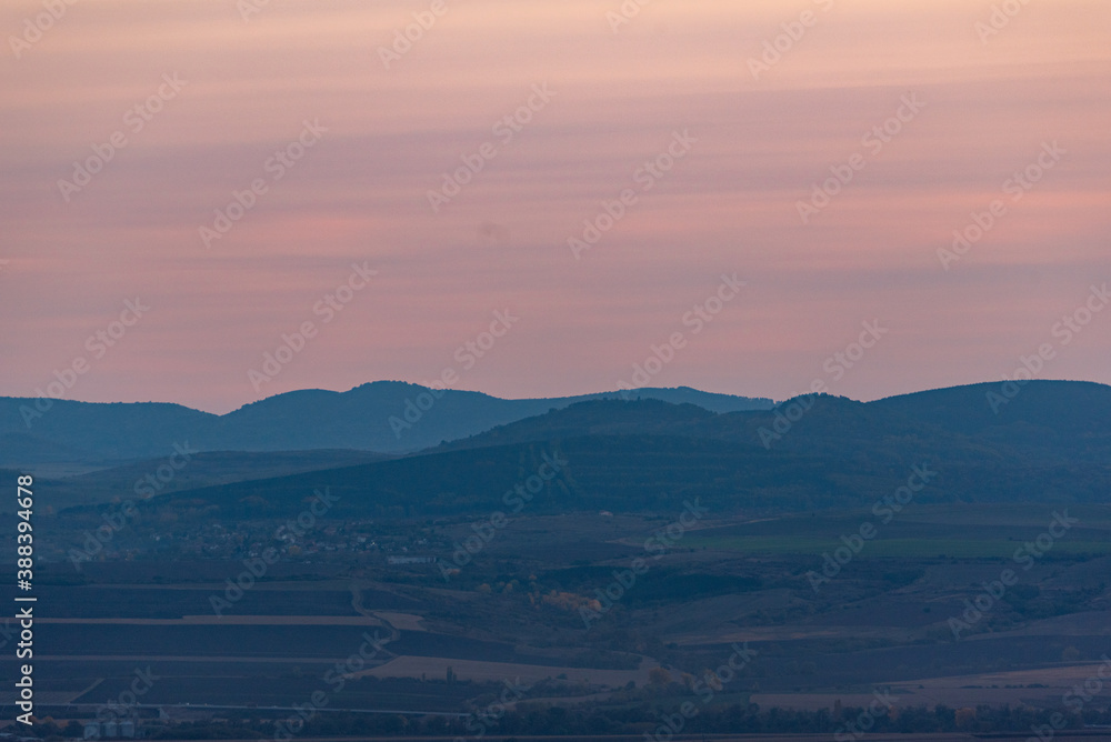 Landscape sunset colors over mountains and hills orange red yellow blue shades natural beauty bulgaria rural