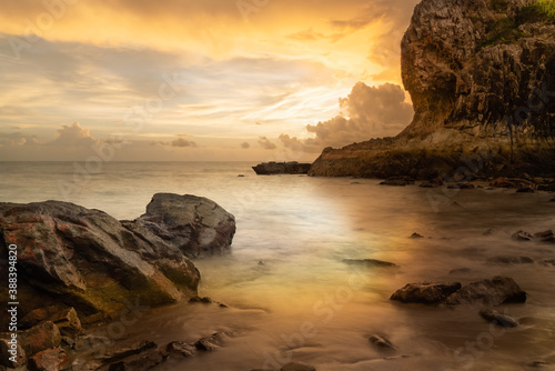 Golden sunshine behind mountain with a storm brewing photo