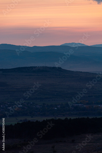 Landscape sunset colors over mountains and hills orange red yellow blue shades natural beauty bulgaria rural