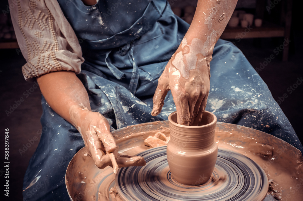 Craftsman master making ceramic pot on the pottery wheel . Concept for woman in freelance, business, hobby. Close-up. Craftsman master making ceramic pot on the pottery wheel . Concept for woman in freelance, business, hobby. Close-up.