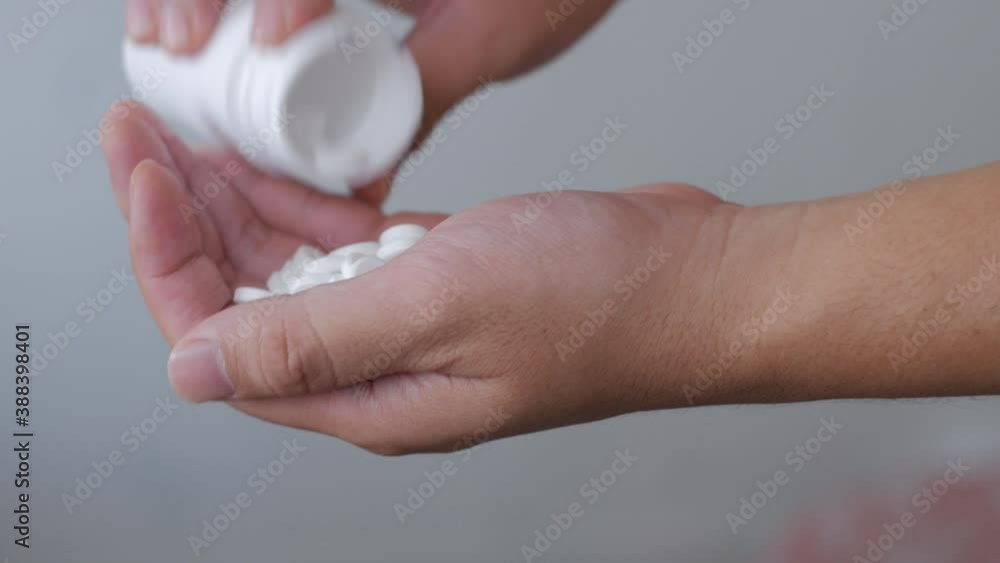 Addict man pouring pills to his hand. Social disaster and epidemic of drugs narcotic addiction Addict man pouring pills to his hand. Social disaster and epidemic of drugs narcotic addiction