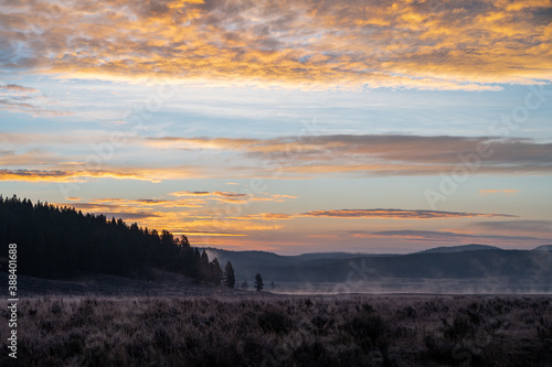 Colorful sunrise in Hayden Valley  with steam coming up from the Yellowstone River