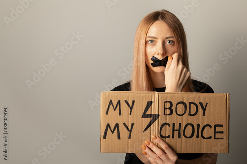 A woman protests against the ban on abortion in Poland. A feminist defends women's rights.