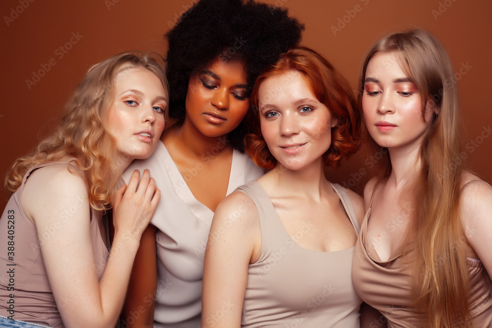 young pretty caucasian, afro, scandinavian woman posing cheerful together on brown background, lifestyle diverse nationality people concept young pretty caucasian, afro, scandinavian woman posing cheerful together on brown background, lifestyle diverse nationality people concept