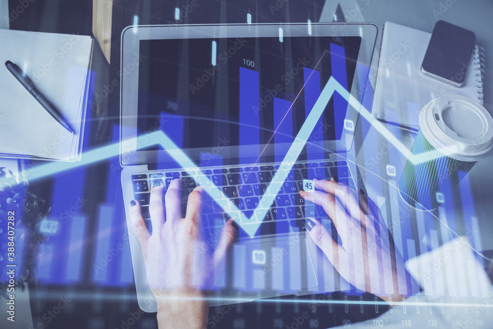 Double exposure of woman hands typing on computer and forex chart hologram drawing. Stock market invest concept. Double exposure of woman hands typing on computer and forex chart hologram drawing. Stock market invest concept.