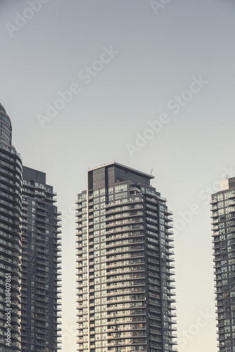 Photography Details of high rise towers against a clear sky at dusk.