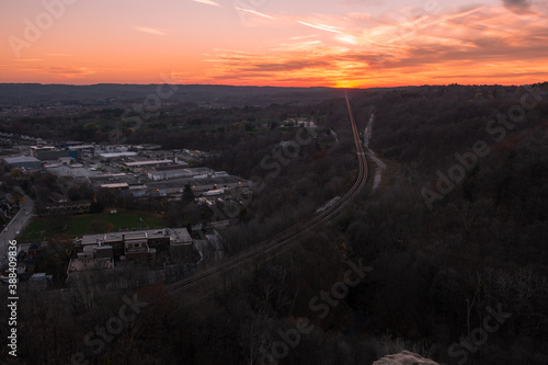 Photography Sunset on a Mountain with Panoramic view below and vibrant sky colours