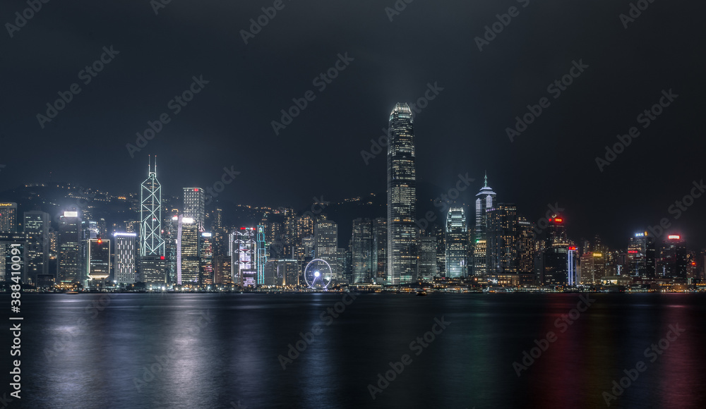 Hong Kong Harbourfront Cityscape Skyling in the Night Time with Vibrant Buildings and Skyscrapers