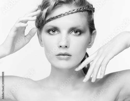 Obraz na plátně Black and white portrait in high key tone female with creative hairdo braids