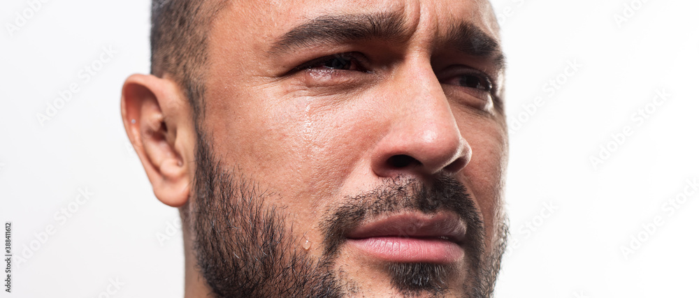 Closeup man crying face. Tears in eyes of cry guy. Closeup man crying face. Tears in eyes of cry guy.