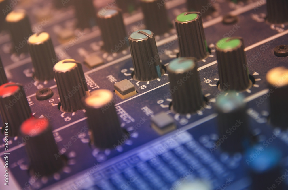 Audio mixer console and professional sound mixing with buttons and sliders. Audio mixer console and professional sound mixing with buttons and sliders.