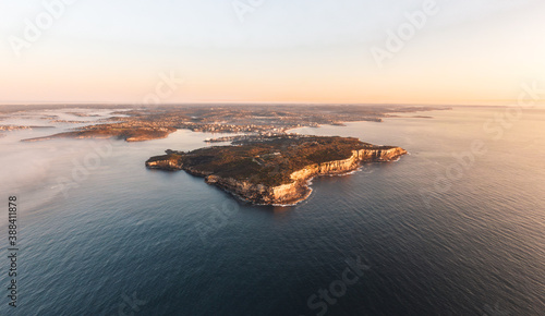XXL panoramic sunrise aerial drone view of North Head, a headland in Manly and part of Sydney Harbour National Park in Sydney, New South Wales, Australia. Manly and Northern Beaches in background.