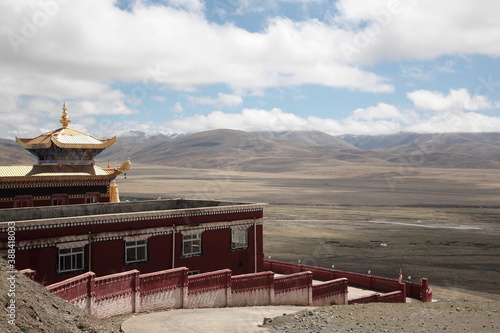 View of the famous Tibetan red sect Nyingmapa Dongga Temple at the holy mountain in Sertar county, Garze Tibetan Autonomous Prefecture, Sichuan, China. photo