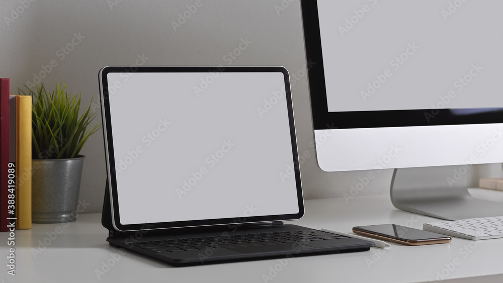 Office desk with tablet, computer and supplies, include clipping path Office desk with tablet, computer and supplies, include clipping path