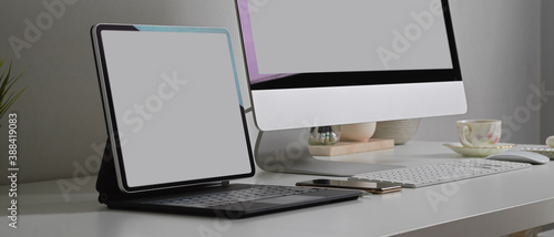 Office desk with tablet, computer and supplies, include clipping path