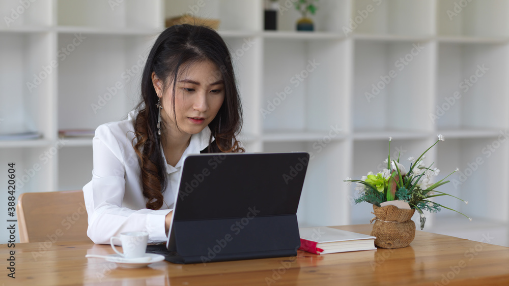 Female businesswoman working on her project with tablet Female businesswoman working on her project with tablet