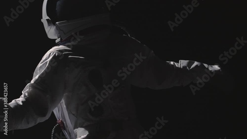 An astronaut floats in space