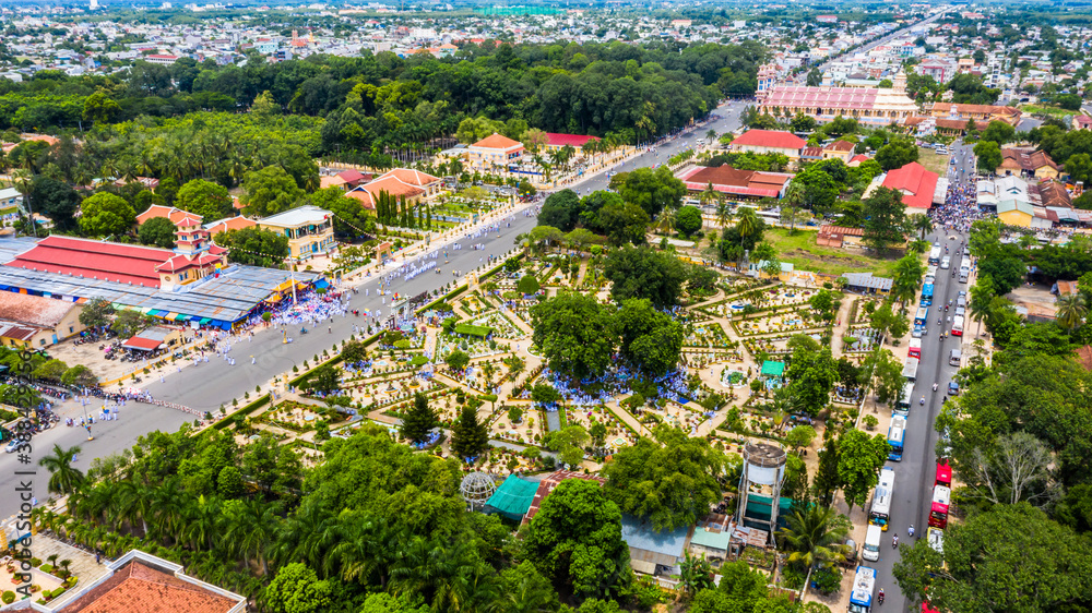 Aerial view of followers and Cao Dai temple in Mid Autumn festival of Cao Dai people ( Caodaism) in Tay Ninh, Vietnam. Travel and religious concept