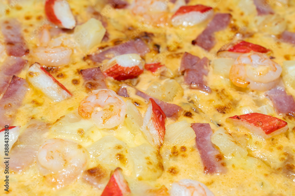 Cover pizza with seafood, ham, shrimp, crab sticks and pineapple, Thailand. Cover pizza with seafood, ham, shrimp, crab sticks and pineapple, Thailand.