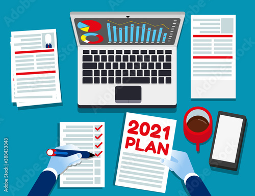 2021 plan text with office accessories. Top view for above
