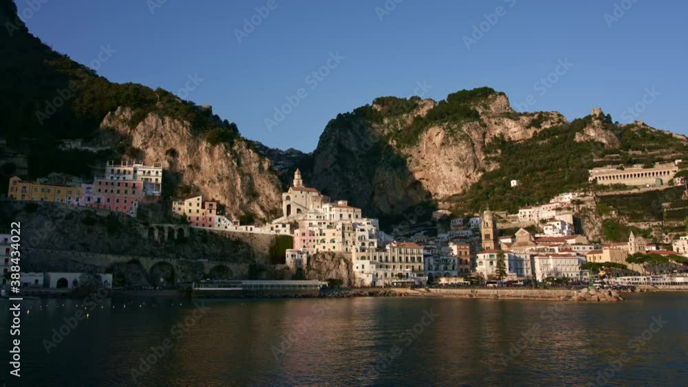 Seeing Amalfi Town with Amalfi Cathedral in Italy from the water, time-lapse, popular travel and holiday destination in Europe Seeing Amalfi Town with Amalfi Cathedral in Italy from the water, time-lapse, popular travel and holiday destination in Europe
