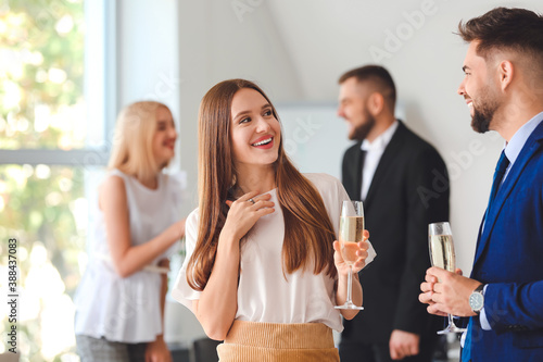 Photography Young people drinking tasty champagne at party in office