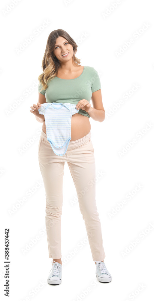 Beautiful pregnant woman with baby clothes on white background Beautiful pregnant woman with baby clothes on white background