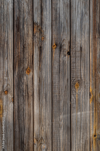 the texture of an old wooden Board. The wall of an old house, sheathed in boards.