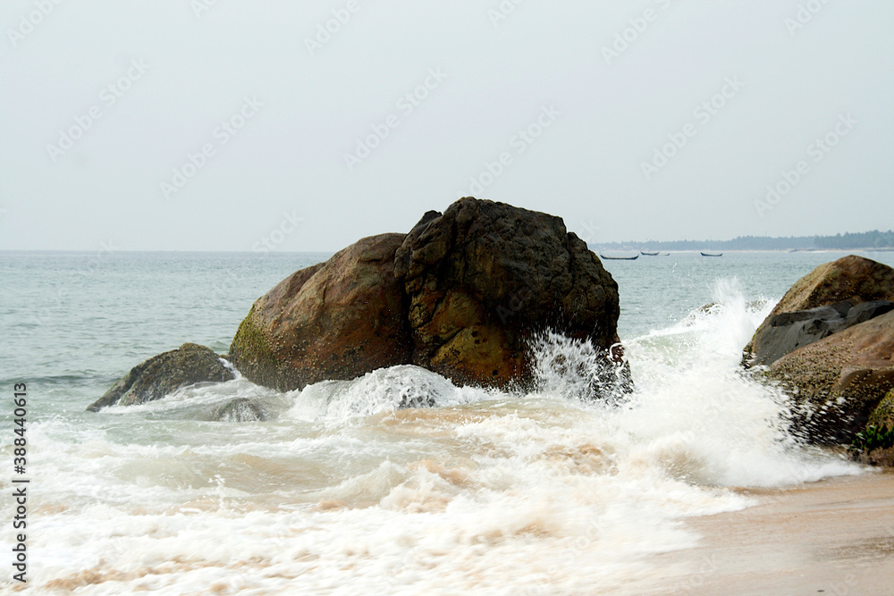 Waves Splashing on Rocks at Beach