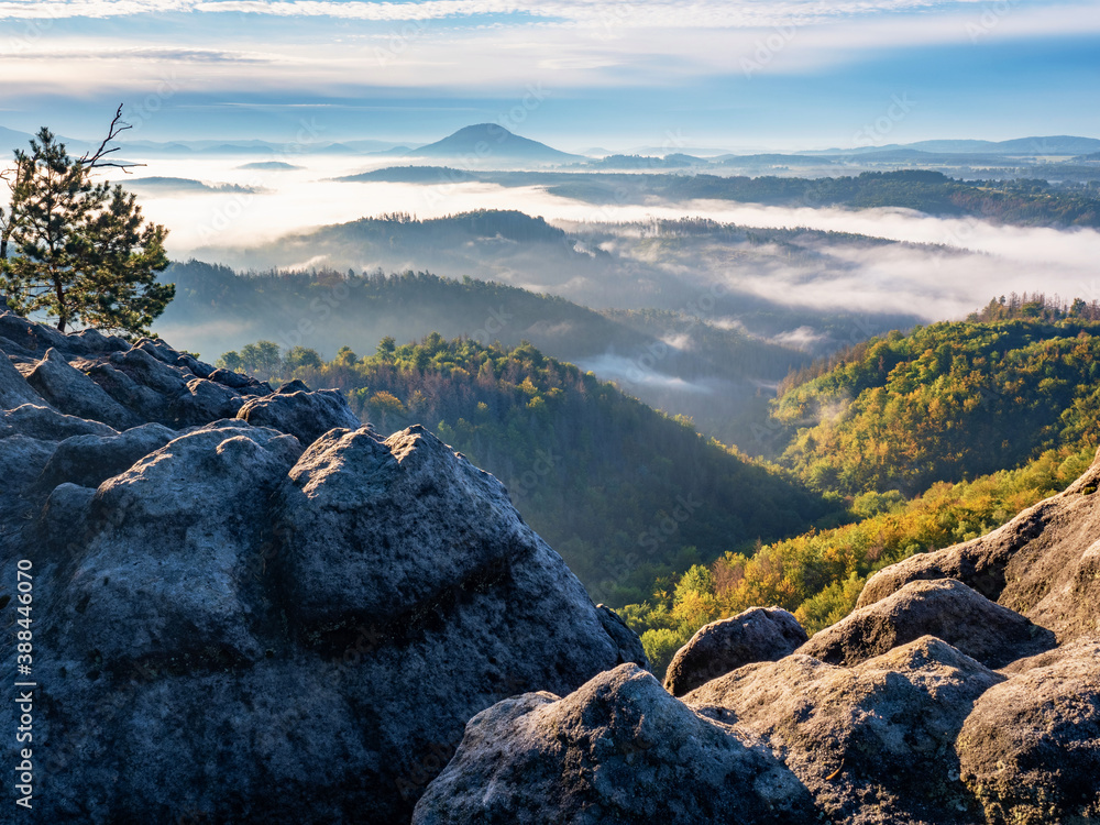 Obraz premium Morning september landscape with first mist in valley