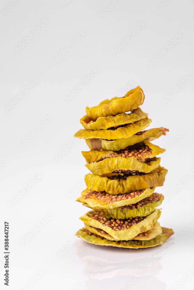 slices of dried figs on a white background. dried fruits. eco. macro. slices of dried figs on a white background. dried fruits. eco. macro.