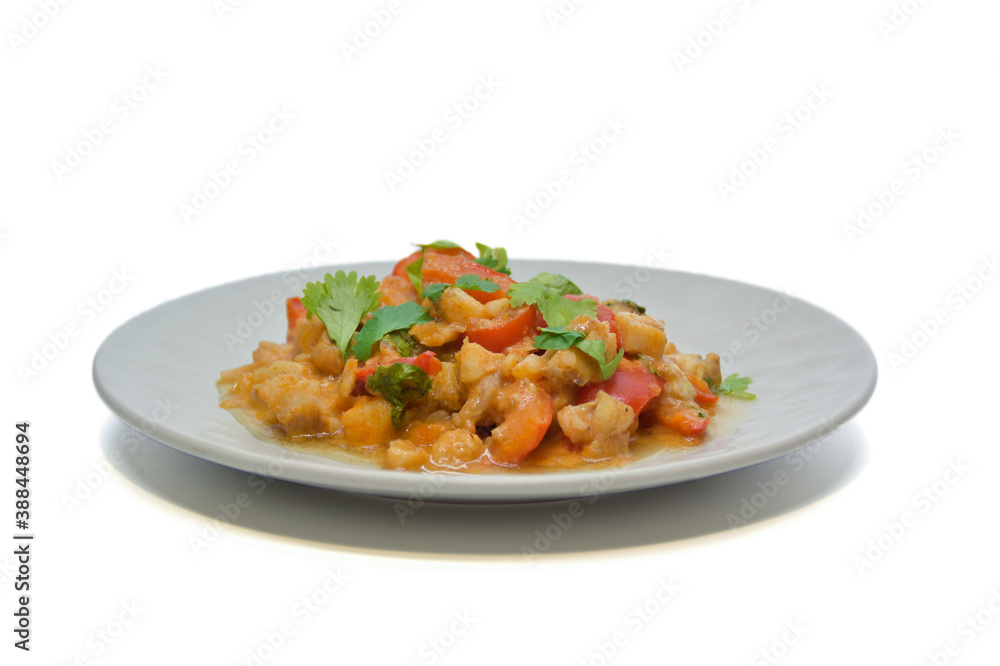 Brazilian fish stew cooked in a delicious, rich and fragrant broth, topped with fresh parsley. Isolated on white background Brazilian fish stew cooked in a delicious, rich and fragrant broth, topped with fresh parsley. Isolated on white background