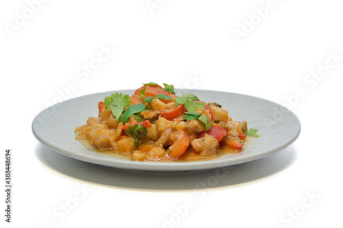 Brazilian fish stew cooked in a delicious, rich and fragrant broth, topped with fresh parsley. Isolated on white background
