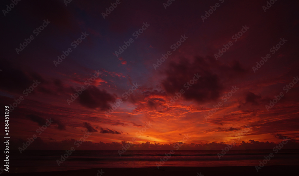 Nature background. Shot of Landscape amazing of red sky sunset in the sea with red clouds background. Travel concept.