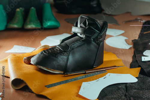 Shoe preparation of sneaker in shoemaker workshop