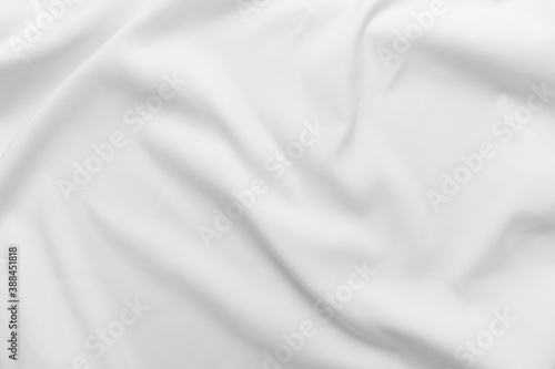Abstract white fabric texture background. Cloth soft wave. Creases of satin. silk and cotton. 