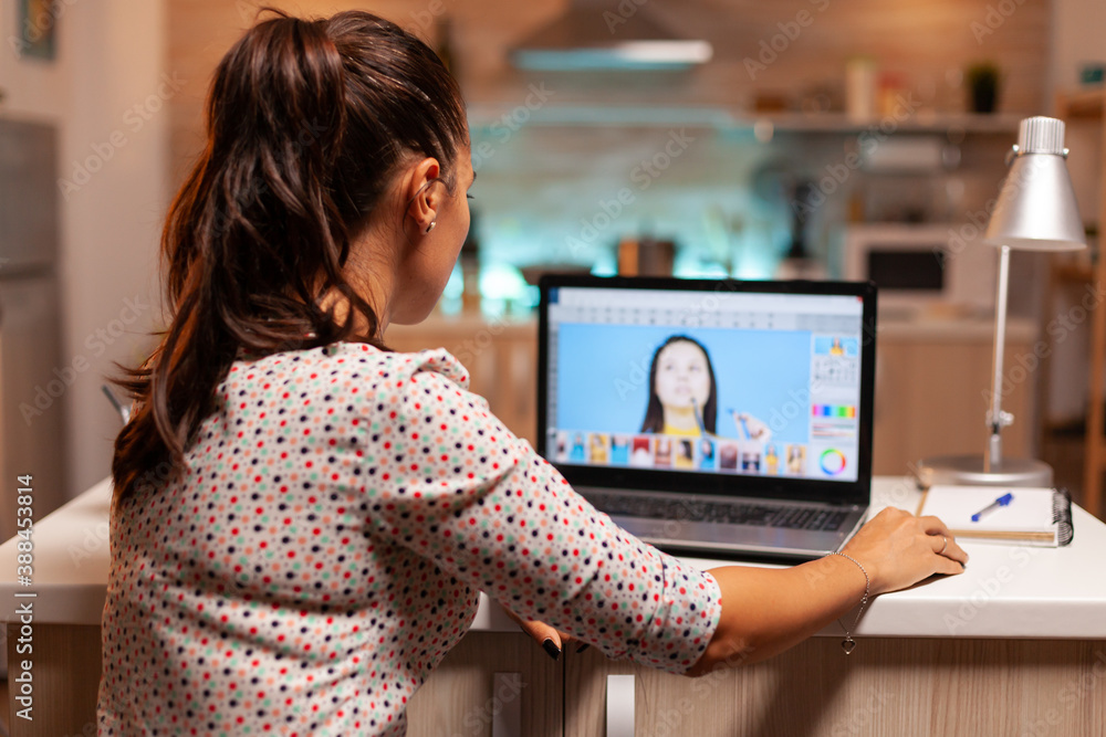 Professional graphic editor retouching photos of a client during night time  in home office. Photographer doing portrait post production using software  and performance laptop, artist, occupation Stock-Foto | Adobe Stock