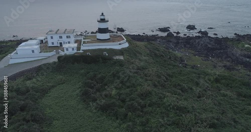 May 17, 2018, The Fuguijiao or Cape Fugui Lighthouse is a lighthouse on Cape Fugui near Laomei Village in Shimen District, New Taipei City, Taiwan. photo