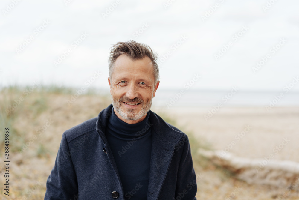 Handsome middle-aged man smiling at camera Handsome middle-aged man smiling at camera